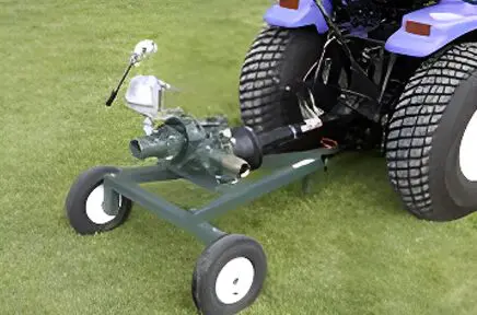 A green tractor with a blue and white engine.