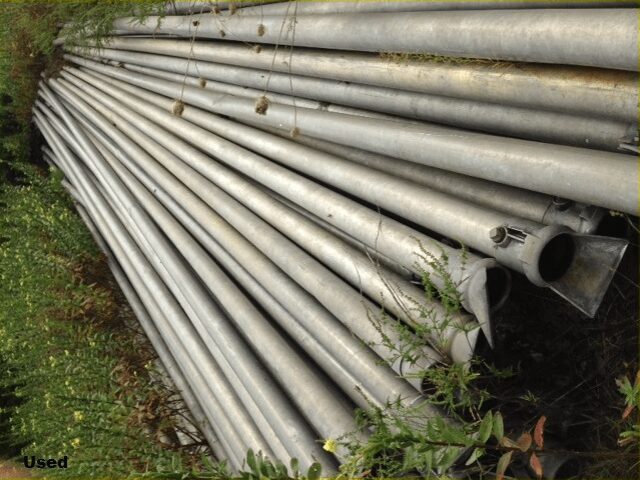 A bunch of pipes that are in the grass.
